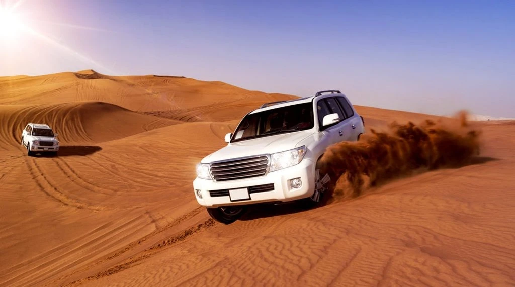 Desert safari vehicle and sand tracks in Dubai